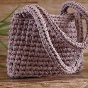 Open crochet tote bag showing spacious interior and structured base for everyday use