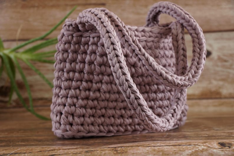 Open crochet tote bag showing spacious interior and structured base for everyday use