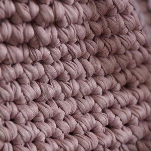 Modern crochet market tote made with t-shirt yarn styled as eco-friendly reusable bag