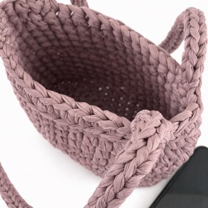 Chunky crochet purse pattern with structured base and soft fabric yarn texture