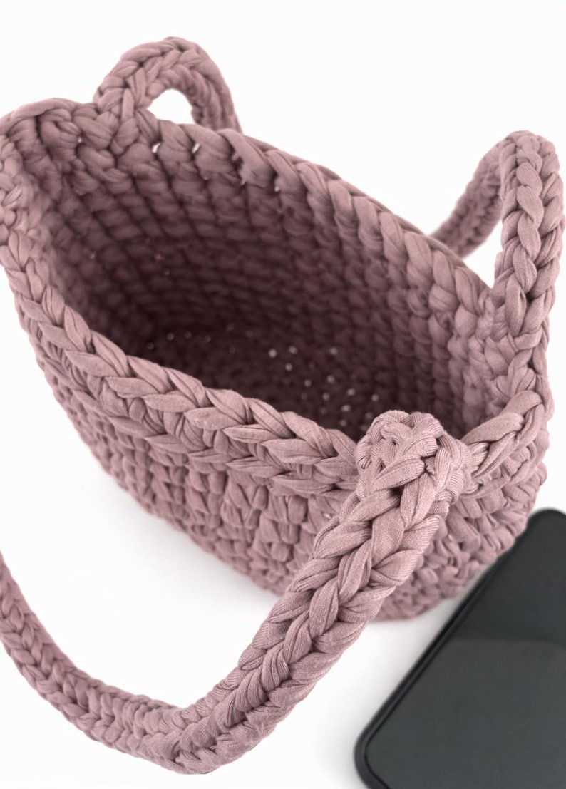 Chunky crochet purse pattern with structured base and soft fabric yarn texture