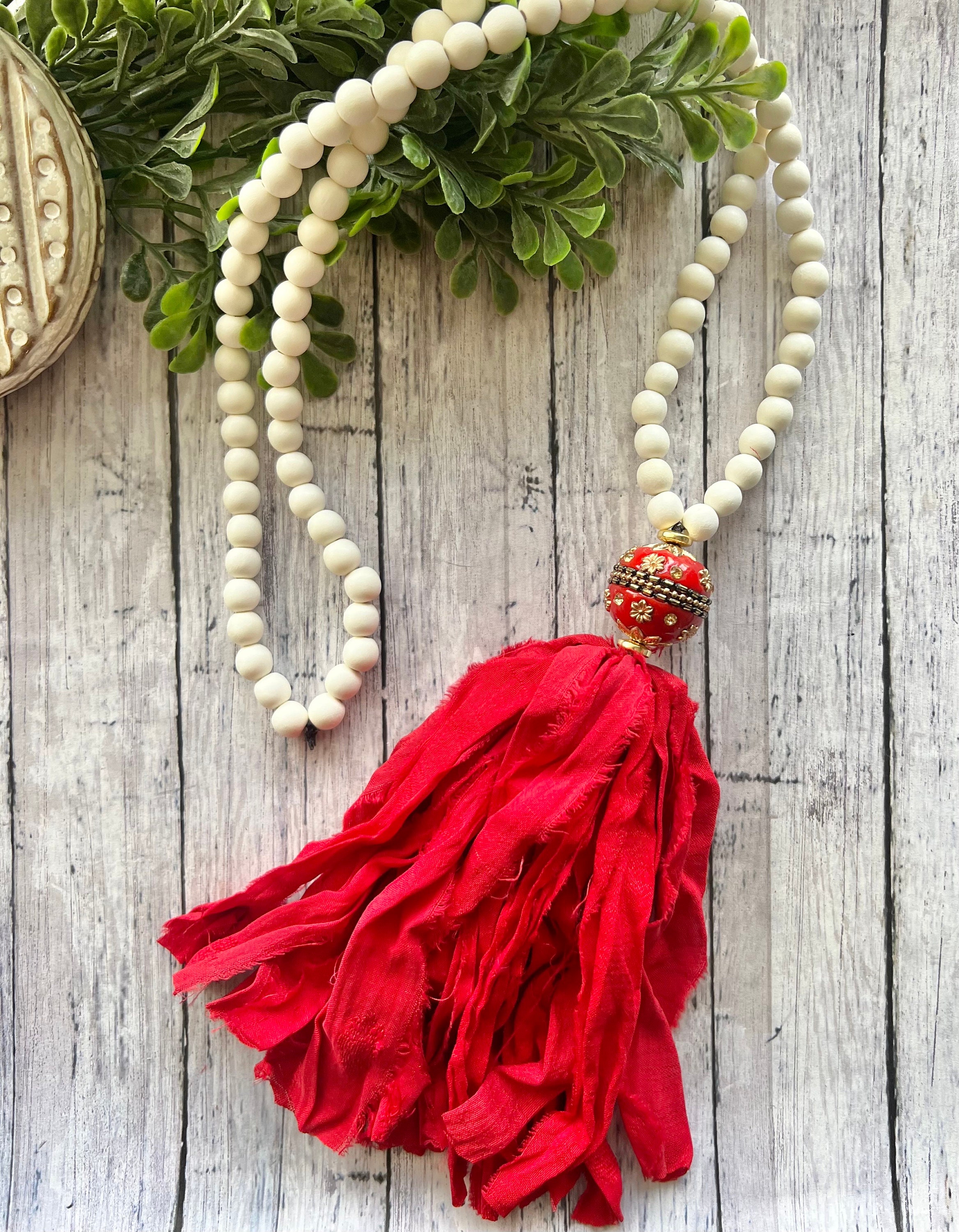 Red tassel necklace discount