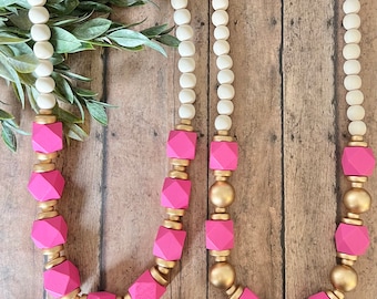Hot pink wood beaded necklace. Long beaded necklace. Hot pink. Gold. White. Wood Bead Necklace. Statement necklace. Chunky pink necklace.