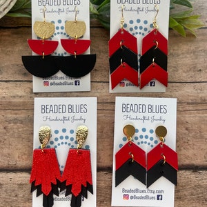 May include: Four pairs of handmade earrings featuring geometric shapes in red, black, and gold. The earrings are displayed on white cards with the text "Beaded Blues Handcrafted Jewelry" and social media information.