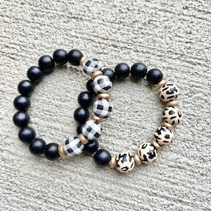 Animal print buffalo plaid wood beaded bracelet. Gold accents. Black dotted. Cream. white plaid. Cheetah bracelet.