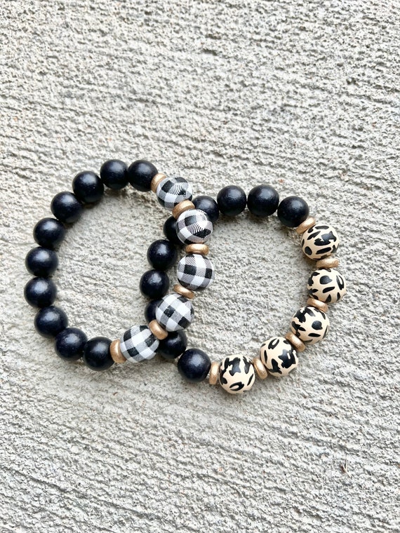 Animal print buffalo plaid wood beaded bracelet. Gold accents. Black dotted. Cream. white plaid. Cheetah bracelet.