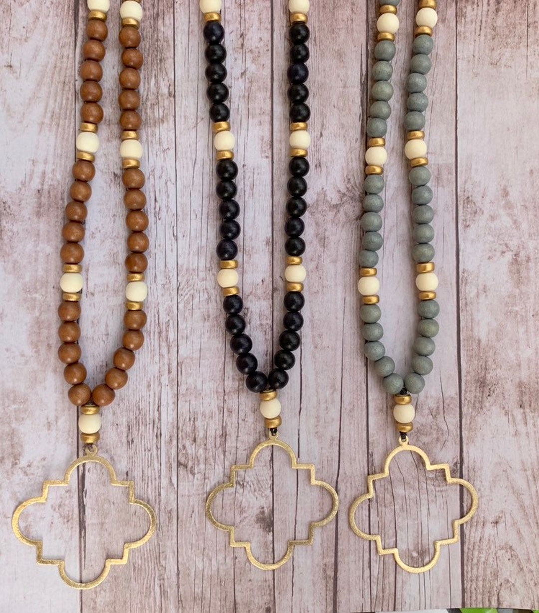 Black Beaded Necklace with Mustard Leather Feather Pendant main image 1
