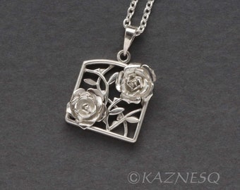 Fully fabricated rose motif silver pendant necklace