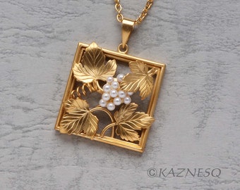 Art Nouveau style gold tone grape motif square pendant necklace