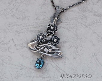 Art Nouveau style London blue topaz and white sapphire oxidized silver floral pendant necklace.