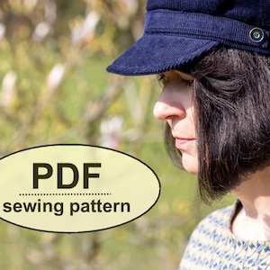 May include: A PDF sewing pattern for a navy blue corduroy newsboy cap. The pattern is available for download.