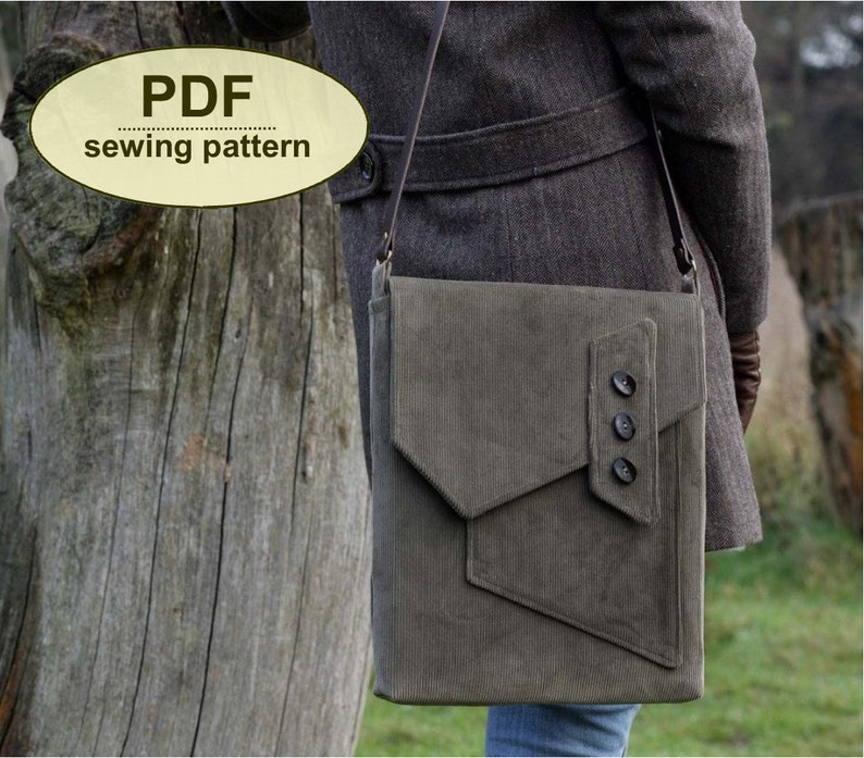 May include: A PDF sewing pattern for a green corduroy crossbody bag with a flap closure and three buttons. The bag is being worn by a person wearing a gray coat.