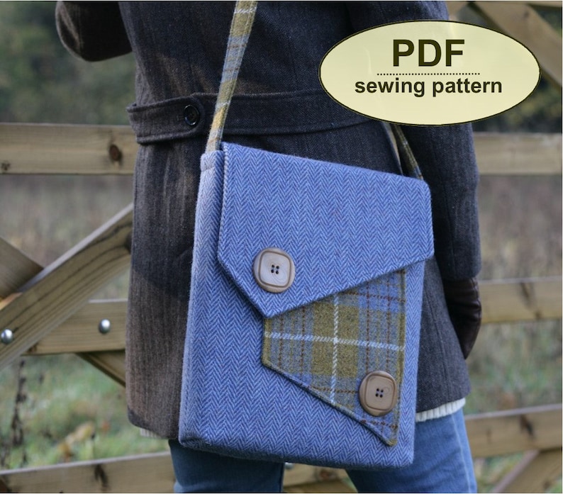 May include: A blue and green tweed crossbody bag with a flap closure and two brown buttons. The bag has a plaid fabric accent on the front. PDF sewing pattern.