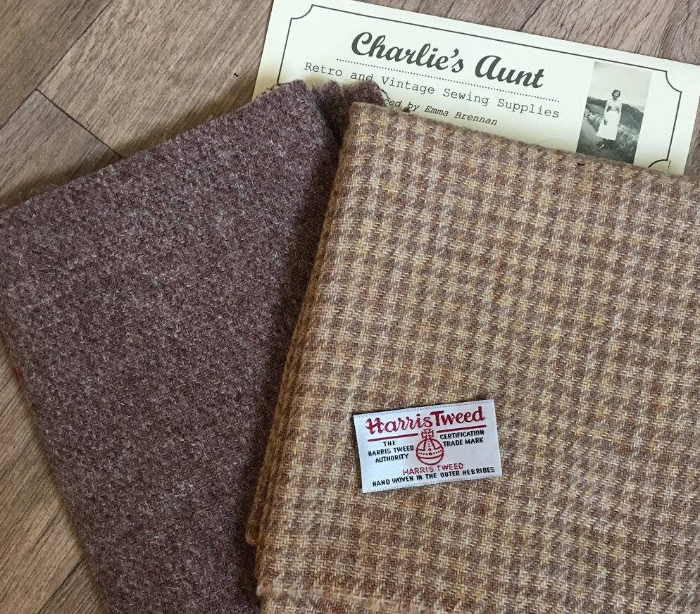 Two pieces of handwoven Harris Tweed fabric - one in plain and one hounds' tooth check with labels