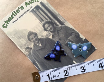 TWO vintage ceramic buttons in the shape of a butterfly approx. 35mm by 23mm, dating back to the 1990s