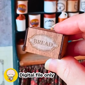 May include: Miniature wooden bread box with the word "BREAD" etched on the front. The box is brown and has a vintage aesthetic. The background features a miniature kitchen cabinet with jars and containers. The image also includes the text "Digital file only".