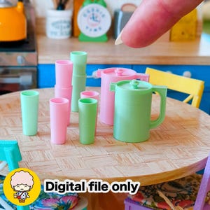 May include: Miniature kitchen set with pink and green cups, a green pitcher, and pink pots. The text "Digital file only" is visible in the image. The objects are arranged on a wooden table.