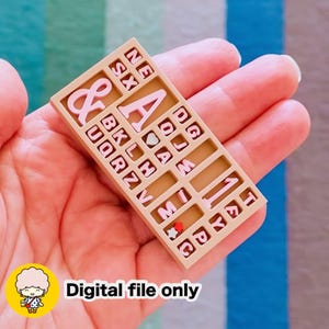 May include: A tan rectangular organizer filled with pink letters, numbers, and symbols. The letters are in a variety of fonts. The text "Digital file only" is printed in black on the bottom right corner.