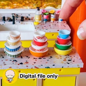 May include: A miniature kitchen scene featuring stacks of colorful bowls in various sizes. The bowls are in shades of white, orange, red, green, yellow, and blue, with decorative patterns. The image includes the text "Digital file only".