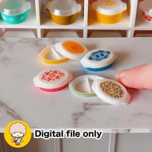 May include: Miniature Pyrex-style dishes with colorful lids. The lids feature various patterns in orange, blue, and red. The text "Digital file only" is visible in the lower left corner.