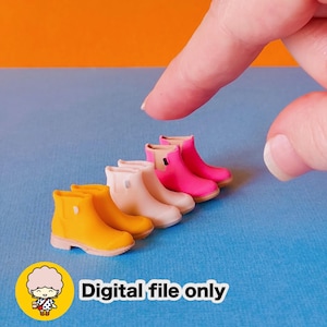 May include: A collection of miniature rubber boots in yellow, cream, and pink. The boots are arranged in a row on a blue surface. The text "Digital file only" is displayed below the boots.