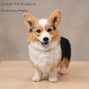 May include: A handcrafted corgi sculpture with a smiling expression. The dog has a white chest, black and tan markings, and large, upright ears. The text "Custom Pet Sculpture from Your Photo" is visible.