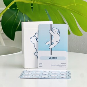 A beginner deck in a white box with a polar bear on a pole. The card in front of the box has a bear in a vortex trick.