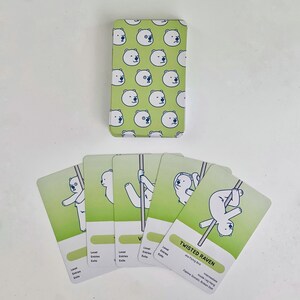 Examples of the deck of intermediate green cards. The card back is light green with a pattern of white polar bear faces. The cards fanned out feature white polar bears in various intermediate poses on a light green background.