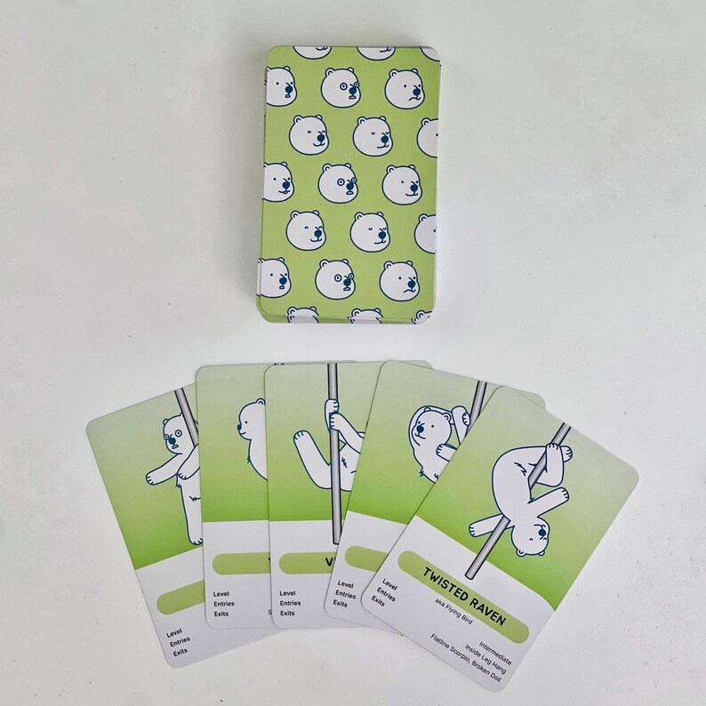 Examples of the deck of intermediate green cards. The card back is light green with a pattern of white polar bear faces. The cards fanned out feature white polar bears in various intermediate poses on a light green background.