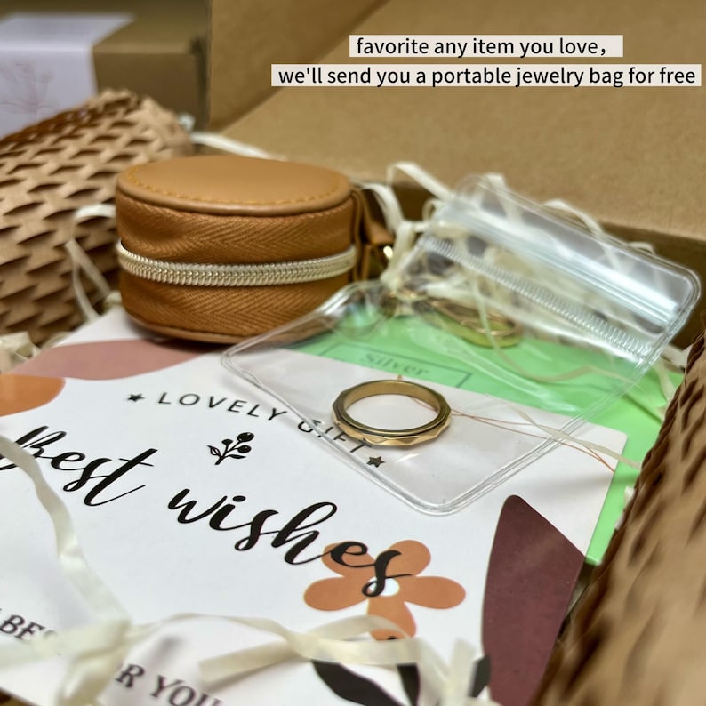May include: A gold ring with a geometric design is displayed in a clear plastic bag. A small, round, tan jewelry case with a zipper is also visible. The text "favorite any item you love, we'll send you a portable jewelry bag for free" is in the background.