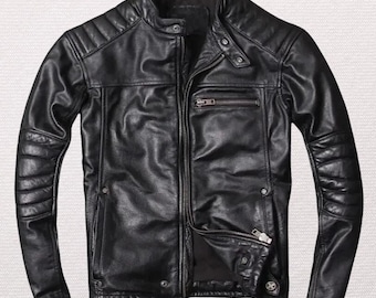 May include: Black leather jacket with a stand-up collar, zipper closure, and multiple pockets. The jacket features quilted shoulder and elbow detailing. A classic, stylish outerwear piece.