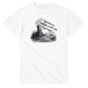 May include: White t-shirt featuring a black and white graphic of a graveyard scene with a tombstone, moon, and skull. Text reads "Don't blame me, I didn't vote for ANY of the Crypt-Keepers."
