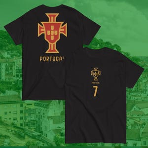 May include: Black t-shirts with a gold and red emblem and the word "PORTUGAL" printed on them. One shirt has the number 7 printed on it. The shirts have a crew neck and short sleeves.