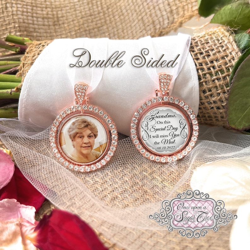 May include: Double-sided memorial charm with a rose gold finish. One side features a photo of a woman, and the other side has a message that reads "Grandma, On this Special Day I will miss You the Most. 08.13.2022".