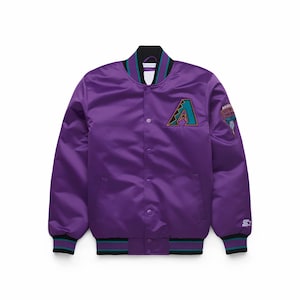 May include: Purple satin bomber jacket with a black collar and cuffs. Features a teal and brown logo on the chest and a patch on the sleeve. The jacket has a snap-button closure and a Starter logo.