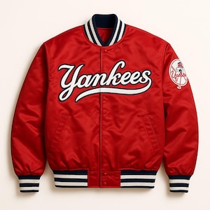 May include: A red satin Yankees baseball jacket. The jacket features white script lettering and a team logo patch. It has a navy blue and white striped collar, cuffs, and waistband.