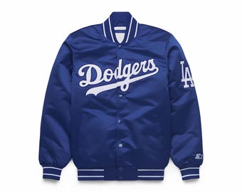 May include: A royal blue satin jacket with white accents and the word "Dodgers" in white script across the chest. The left sleeve features a white "LA" logo. The jacket has a button-up front and striped cuffs and hem.