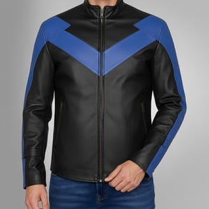 May include: Black leather jacket with blue accents on the shoulders and chest. The jacket has a full-length zipper and a stand-up collar. The sleeves are long, and the jacket appears to be made of a smooth, high-quality leather material.