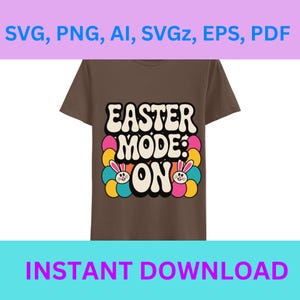 以下が含まれることがあります： レトロなフォントで「EASTER MODE: ON」と書かれた茶色のTシャツ。カラフルなイースターエッグのデザインとウサギの顔が特徴です。Tシャツには「SVG, PNG, AI, SVGz, EPS, PDF」と「INSTANT DOWNLOAD」の文字も含まれています。