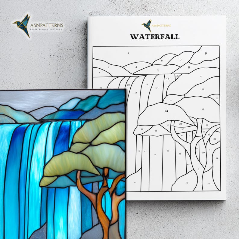 May include: A stained glass panel and a pattern book titled "Waterfall". The panel shows a waterfall in blue and green tones, and a tree with an orange trunk. The book features a line drawing of the same waterfall design.
