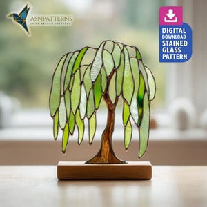 May include: A stained glass willow tree sculpture with green and clear glass leaves and a brown trunk, mounted on a wooden base. The image includes the text "DIGITAL DOWNLOAD STAINED GLASS PATTERN". The logo "ASN PATTERNS" is also visible.