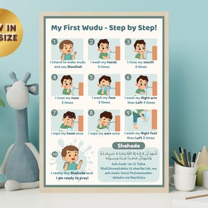 May include: A framed poster titled "My First Wudu - Step by Step!" with illustrations of a child performing ablution. The poster includes text in English and Arabic, with the words "NOW IN A4 SIZE" on a gold tag.