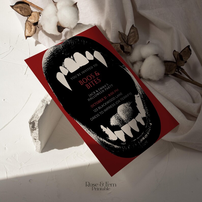 May include: A red Halloween party invitation with a black illustration of a snarling mouth with sharp white teeth. The invitation includes the text "BOOS & BITES" and party details.