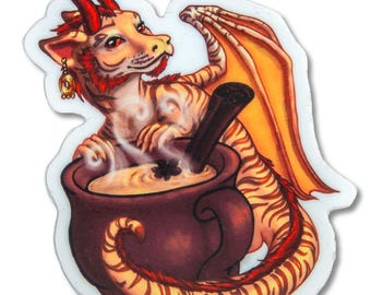 May include: A sticker featuring a cartoon dragon with orange and brown stripes, red horns, and gold earrings. The dragon is in a brown cauldron with a black stirring stick. The dragon has orange wings.