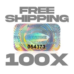 May include: A holographic sticker with the words "AUTHENTIC" and "GENUINE" printed on it. The sticker has a unique design with the number "054373" and the text "100X" below it.