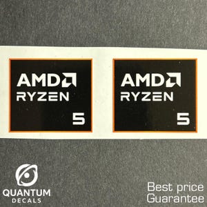 May include: Two black AMD Ryzen 5 decals with white text and an orange border. The decals are square and feature the AMD logo. The bottom of the image shows the Quantum Decals logo and the text "Best price Guarantee."
