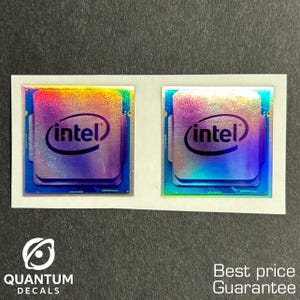 May include: Two Intel processor decals with a holographic finish, featuring the Intel logo in a white font. The decals are on a white backing, with the text "QUANTUM DECALS" and "Best price Guarantee" visible.