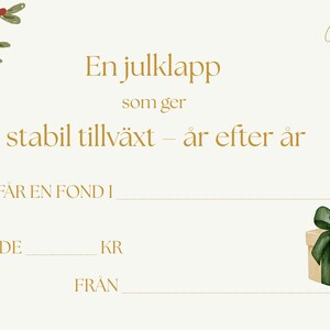 May include: A cream-colored gift certificate with gold text and a watercolor illustration of a gift box with a green bow. The text reads "En julklapp som ger stabil tillväxt - år efter år". A sprig of leaves and berries is in the upper left corner.