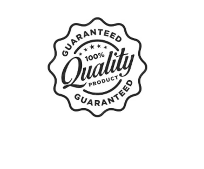 May include: A black and white circular emblem with a scalloped edge. The text reads "GUARANTEED" around the top and bottom, and "100% Quality Product" in the center, with stars. The design is simple and bold.