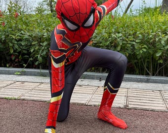 May include: A full-body superhero costume featuring a red and black spider-web pattern with gold accents. The suit includes a matching full-head mask with large white eye lenses, long sleeves, and integrated foot coverings in a sleek, fitted fabric.